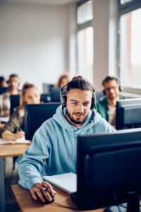 Male,Student,Learning,On,Desktop,Pc,During,Computer,Class,At